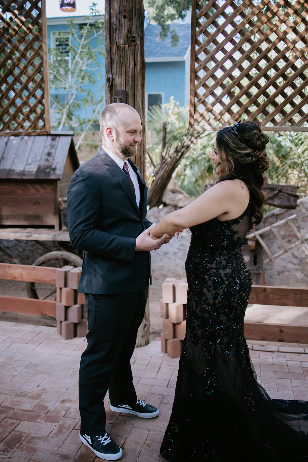 Bride and groom smiling at each other during their first look before the ceremony.
