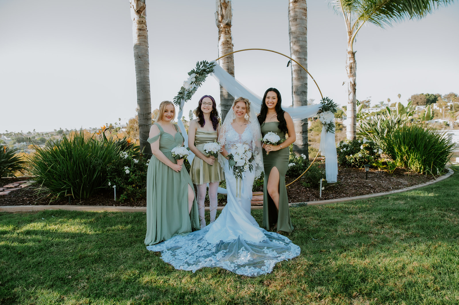 Bride standing with bridesmaids after a family ceremony at an Airbnb wedding, highlighting how to plan an elopement with family in a meaningful, low-stress way.