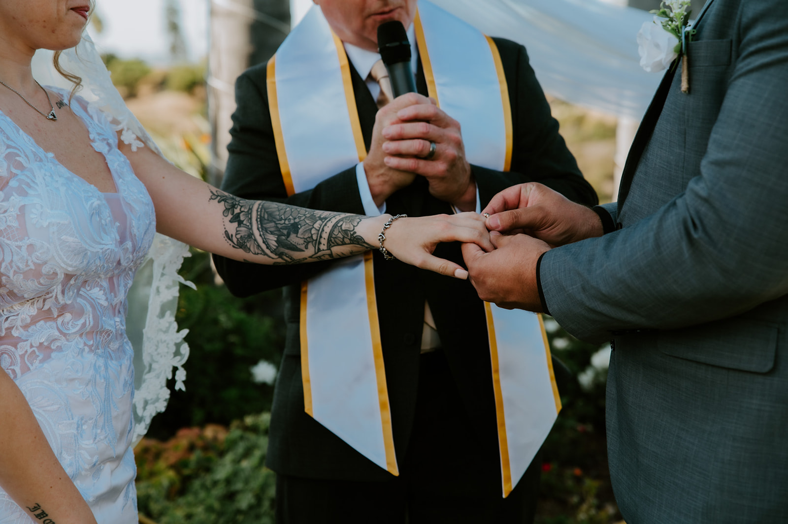 Close-up of the ring exchange during a California elopement ceremony, highlighting intentional details when learning how to plan an elopement with family.