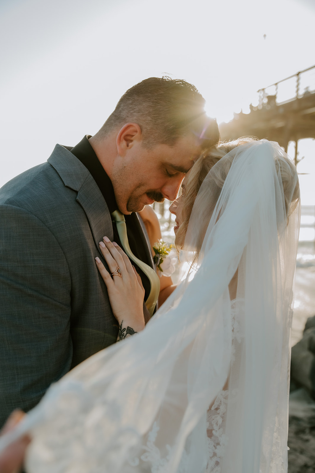 Quiet, emotional moment between the couple near the pier, reflecting how to plan an elopement with family without losing intimacy.