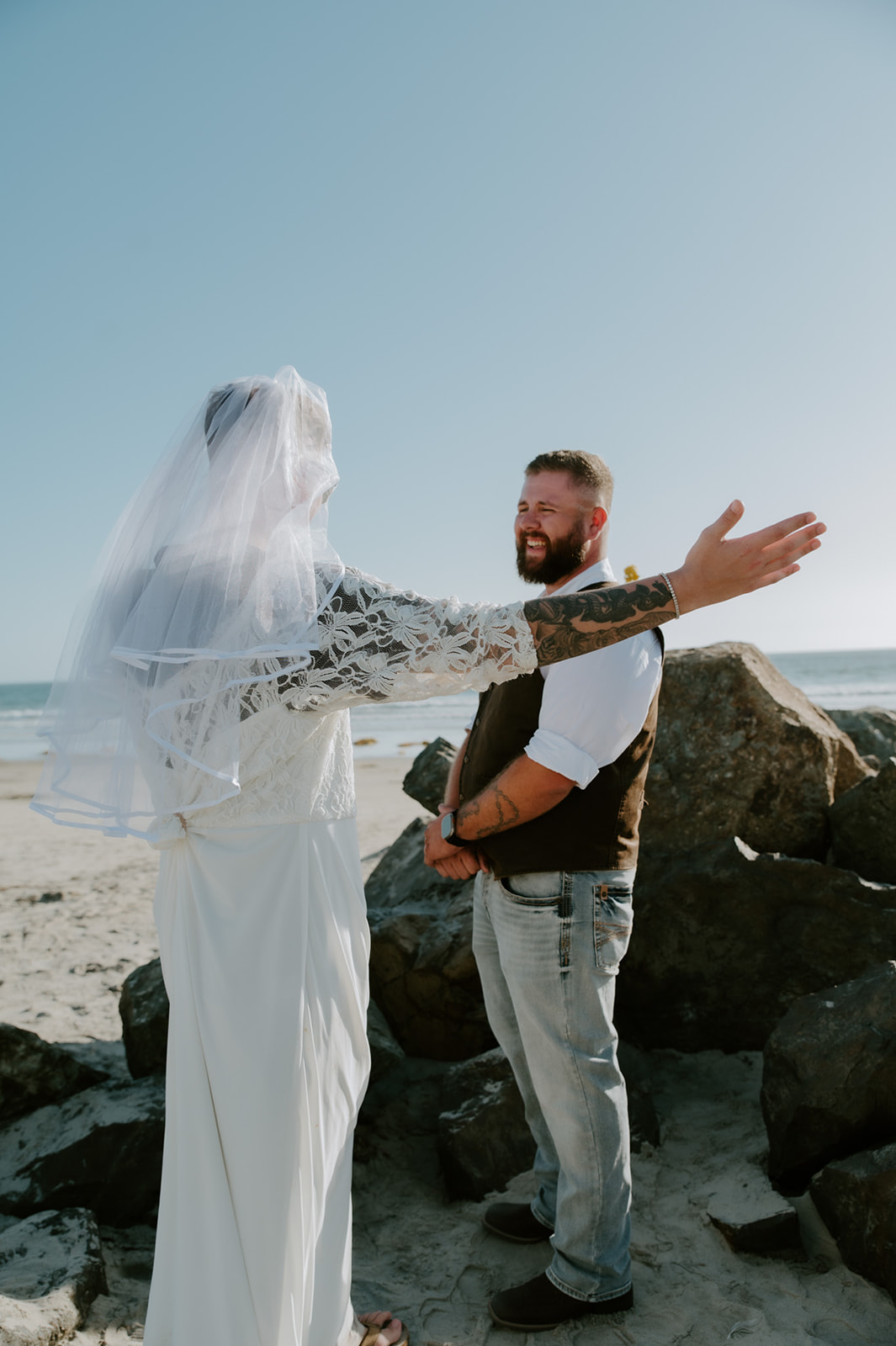 Groom's friend wearing wedding dress and surprising him during first look, all captured by California elopement photographer. 