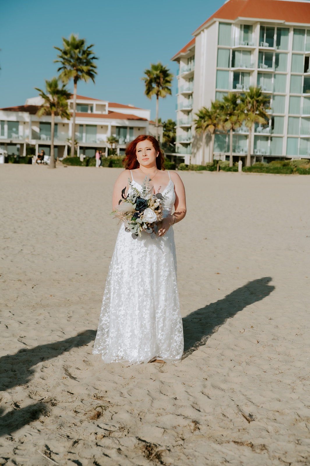 California elopement photographer captures bride walking onto the beach before first look. 