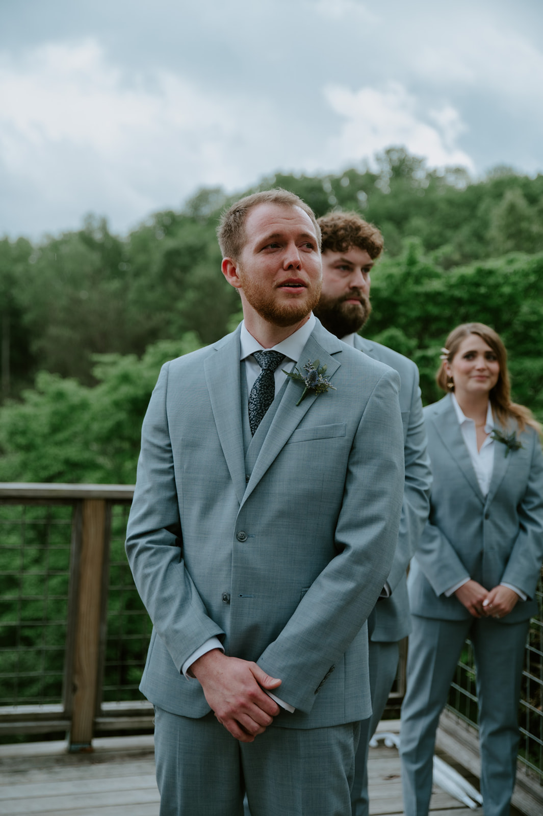 Groom standing at the altar waiting for the bride, emotional moment during a Smoky Mountain elopement ceremony.