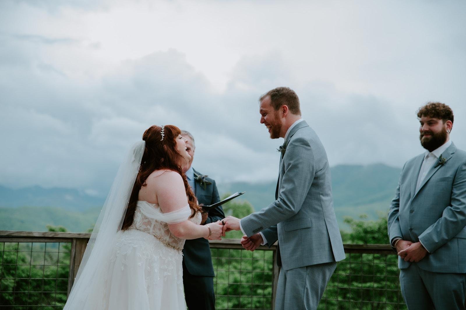 Emotional vow exchange during an outdoor Smoky Mountain elopement ceremony with mountain views.
