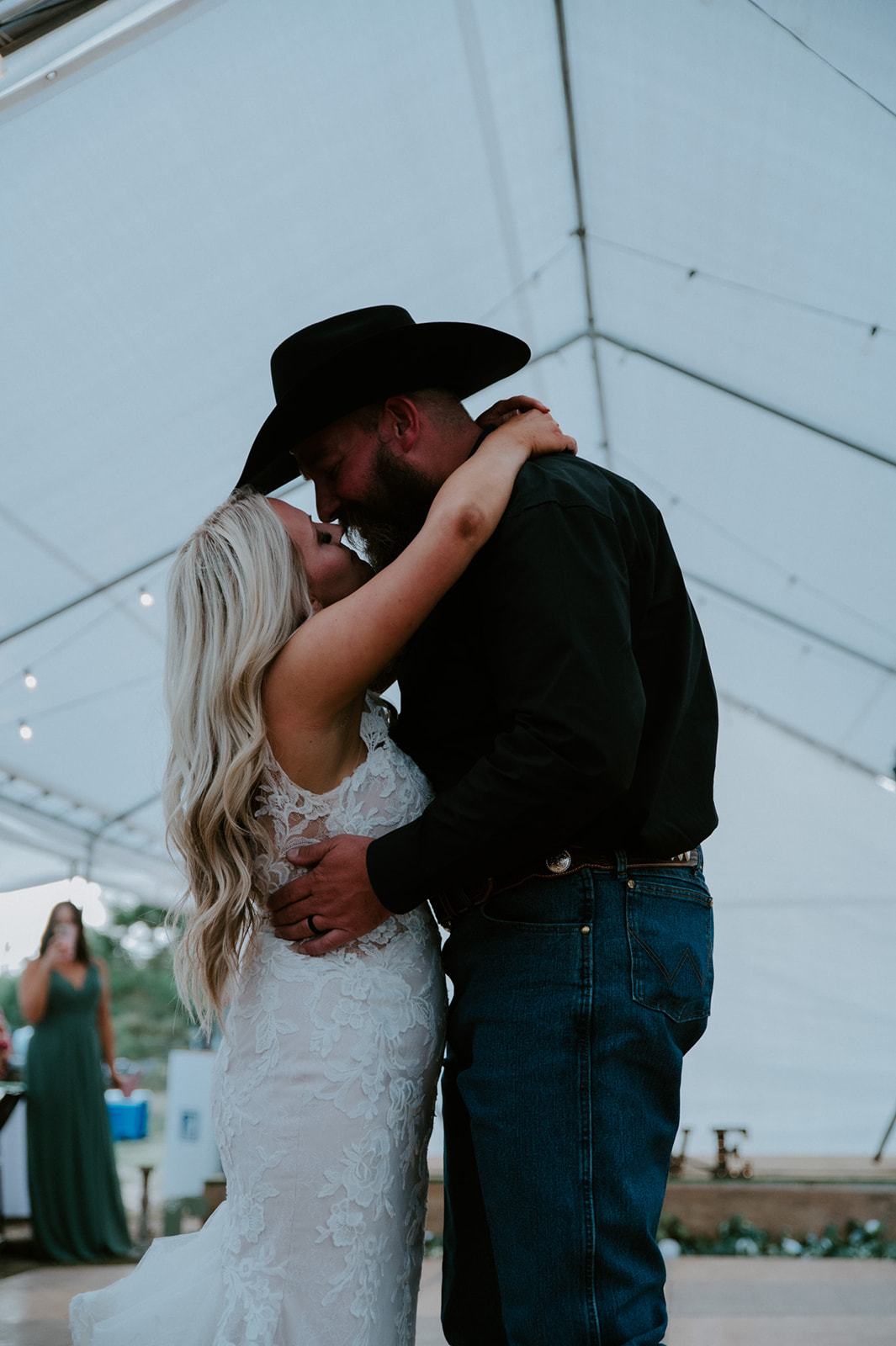 Close embrace between bride and groom on the dance floor after choosing to elope in Arizona.