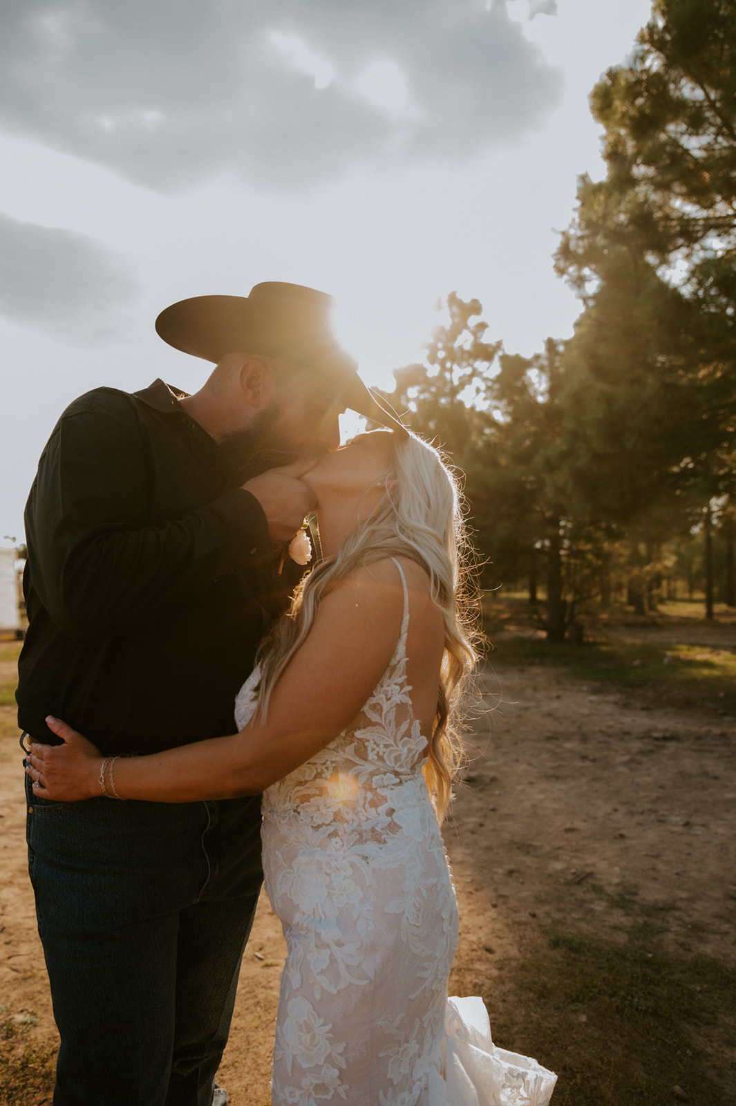 Golden hour kiss in the pine forest as the couple celebrates their decision to elope in Arizona.
