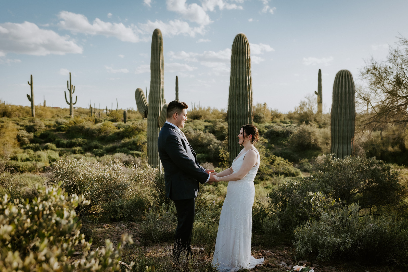 Arizona elopement ceremony moment among saguaro cacti in the Sonoran Desert