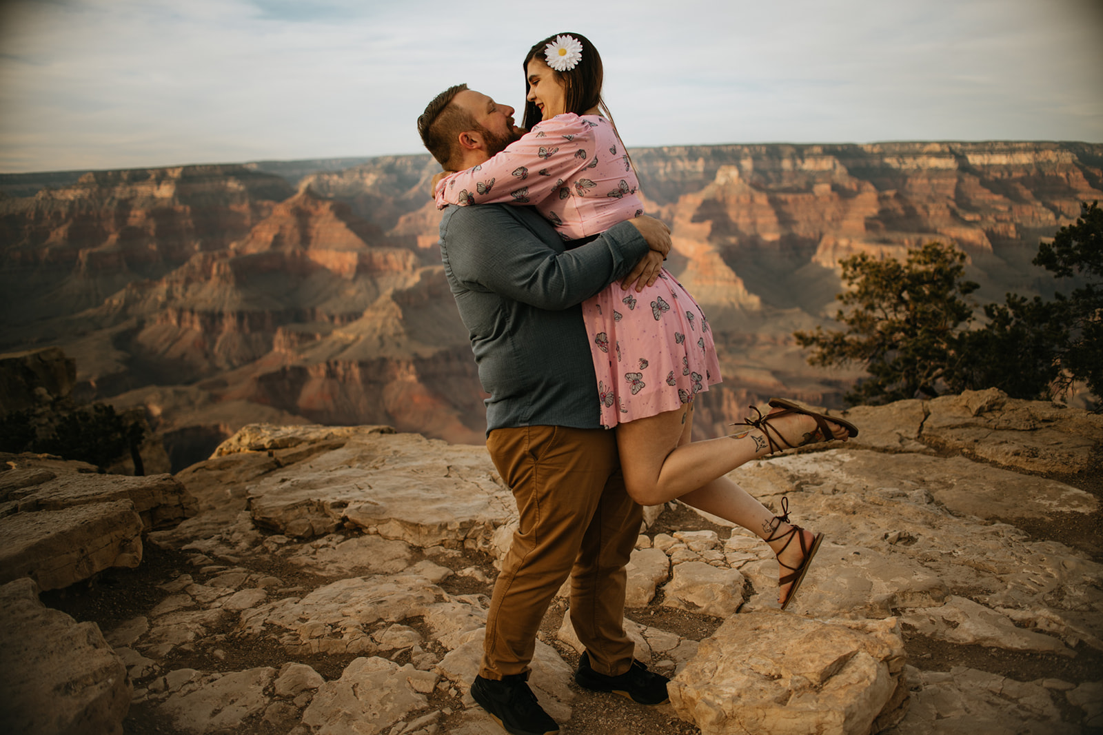 Arizona elopement couple embracing at the Grand Canyon overlook during golden hour