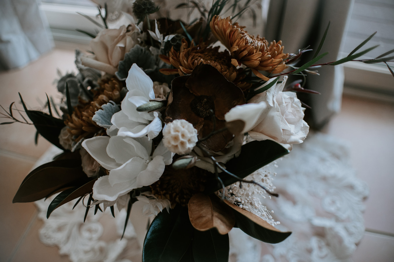 Earth-toned bridal bouquet with dried florals and greenery styled for an elopement in Arizona
