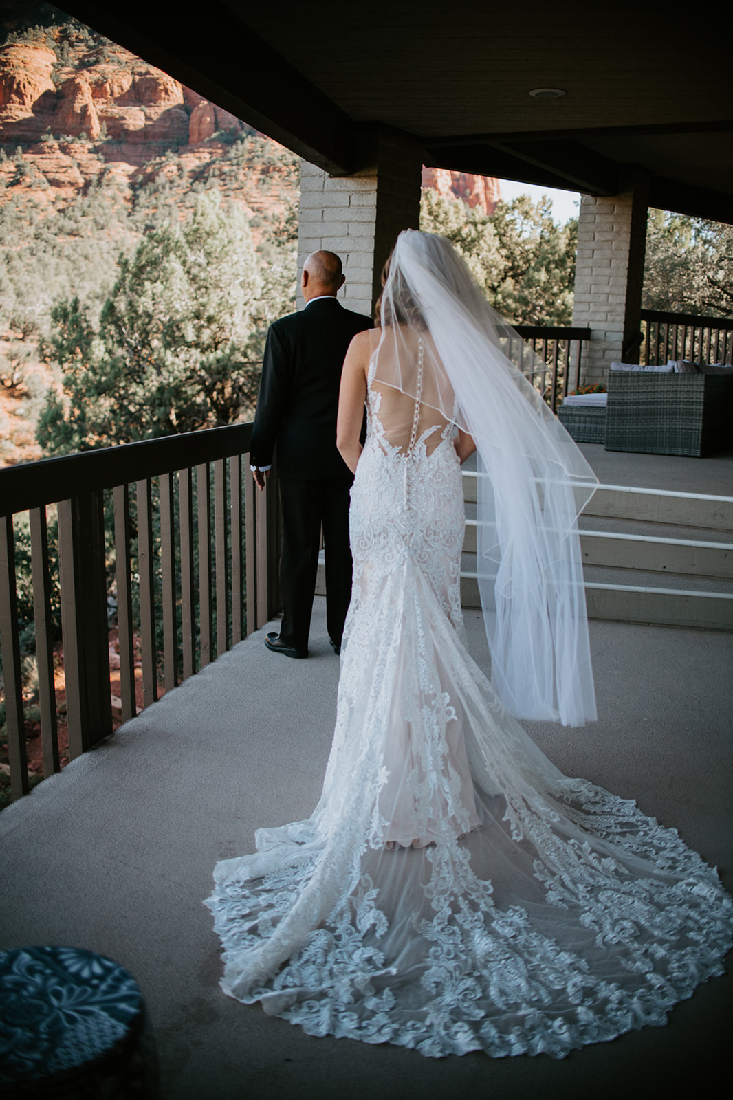 Bride walking toward her partner on a Sedona Airbnb balcony during their elopement in Arizona
