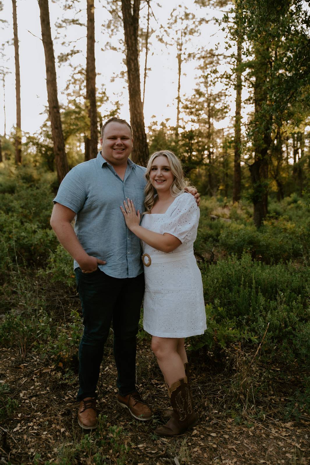 Couple posing together in a wooded Arizona landscape, a beautiful example of adventure elopements in nature
