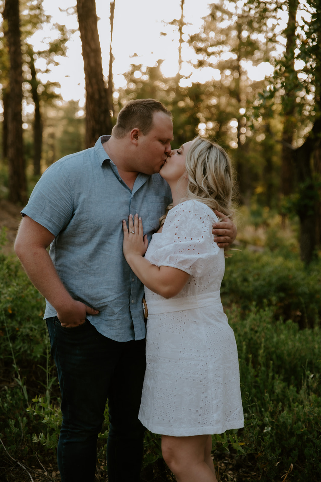 Close-up of a couple sharing a kiss in golden hour light, capturing a romantic adventure elopement moment
