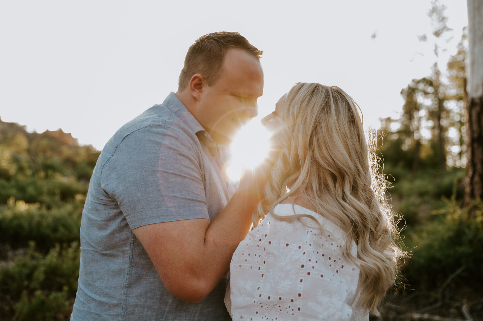 Couple laughing and walking together through a scenic trail, a candid adventure elopement moment
