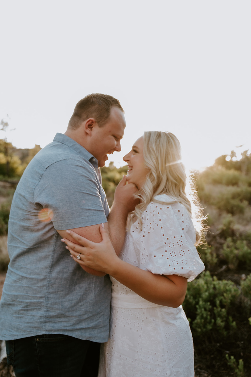 Close-up of a couple smiling and leaning into each other during a quiet adventure elopement moment
