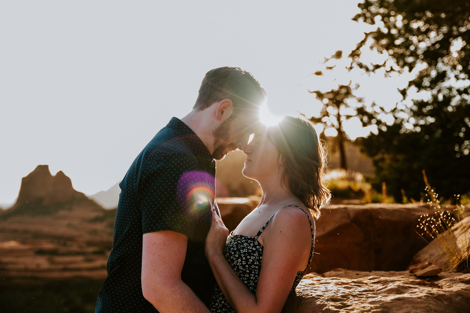 Sunlit close-up of a couple sharing a quiet moment during their decision to elope to Sedona