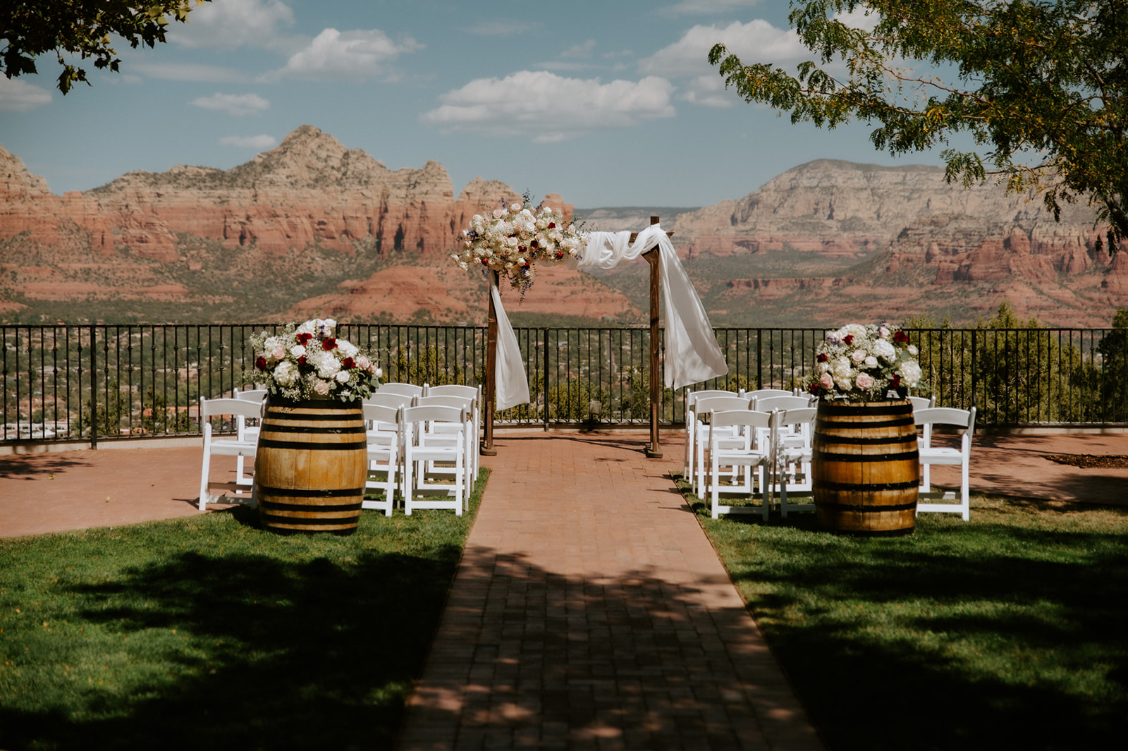Outdoor ceremony setup with floral arch and mountain views for a couple planning to elope to Sedona
