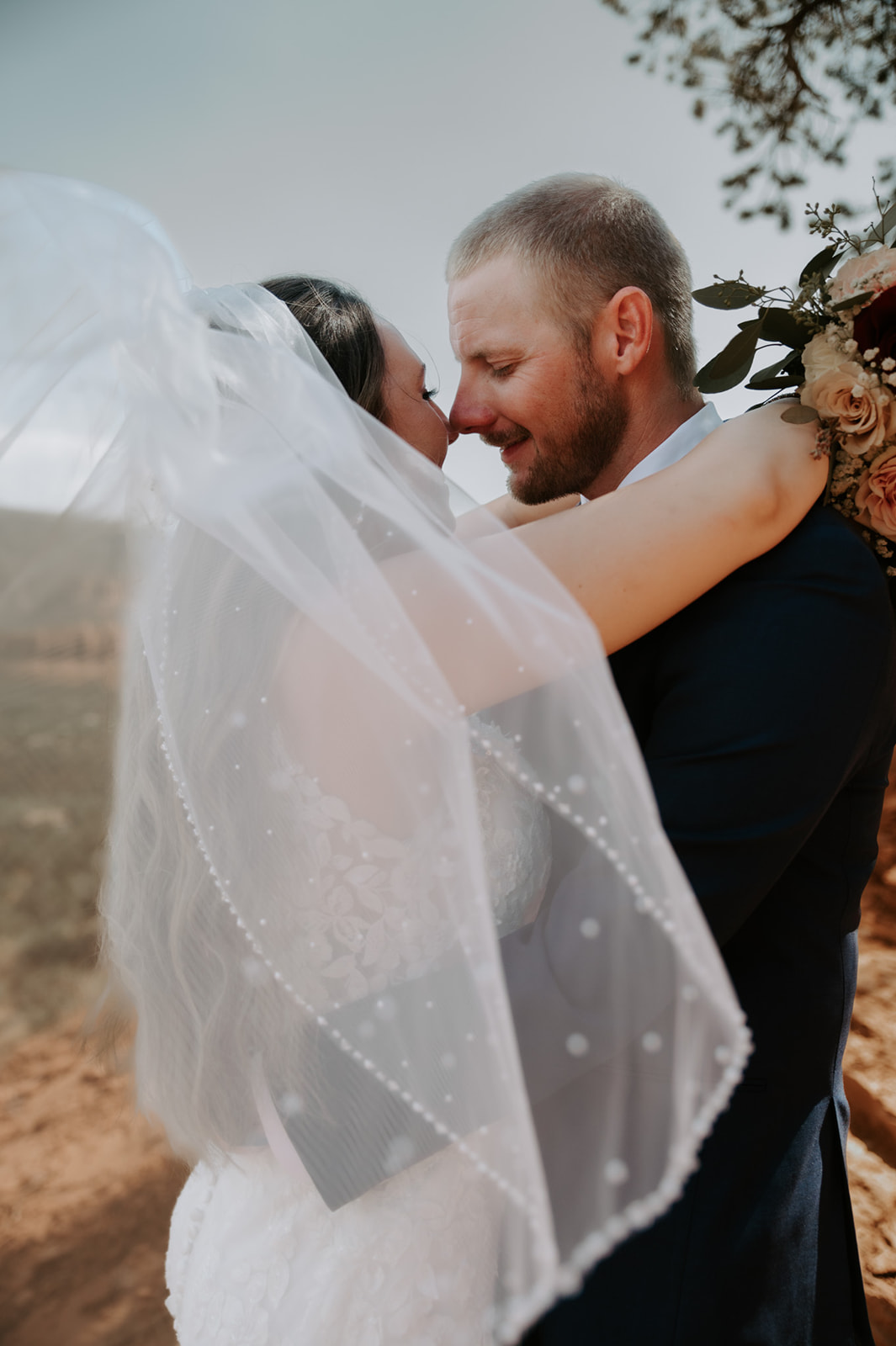 Intimate close-up of a couple smiling together during their Sedona elopement