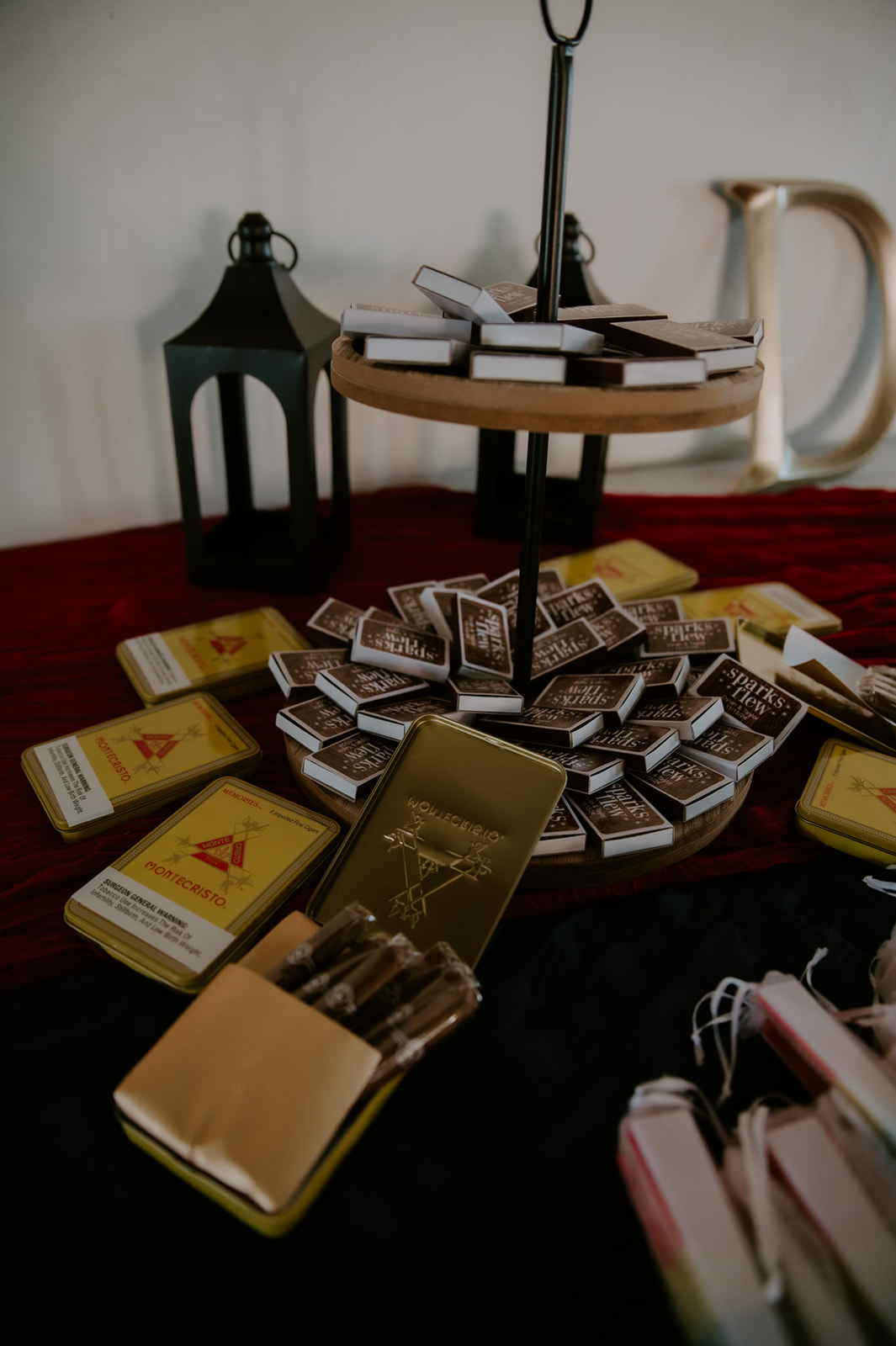 Wedding reception details featuring personalized favors and candles during an intimate same-sex wedding