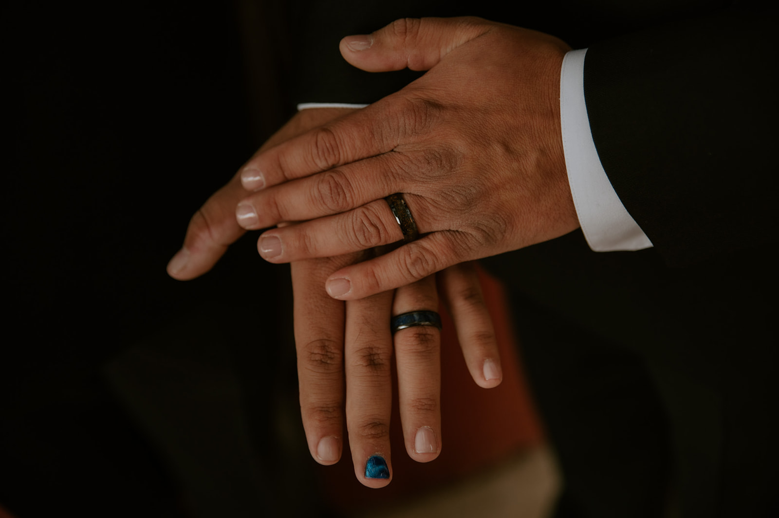 Close-up wedding ring photo during an intimate same-sex wedding photographed by an LGBTQ wedding photographer