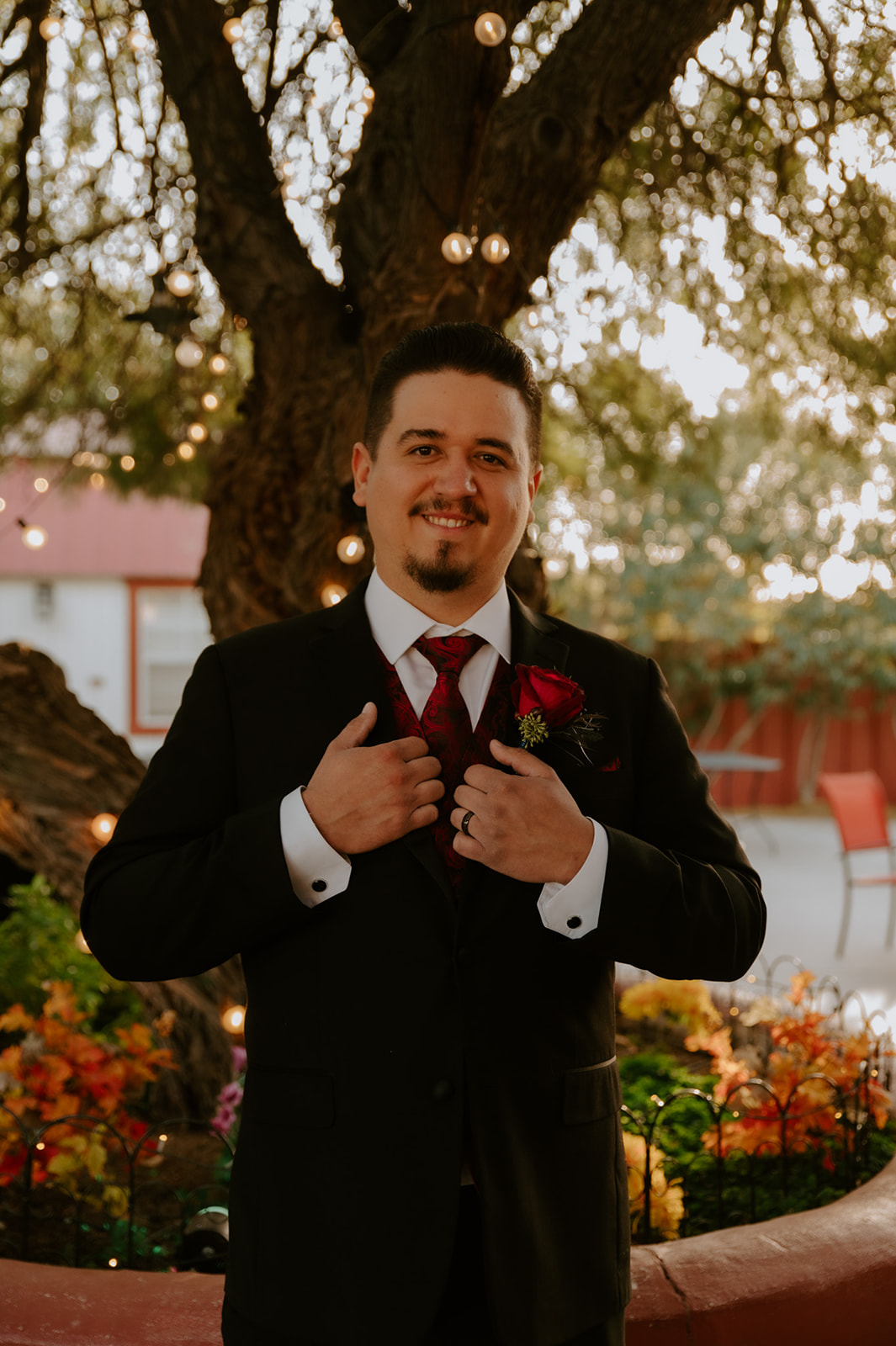 Groom getting ready portrait during a romantic same-sex wedding celebration