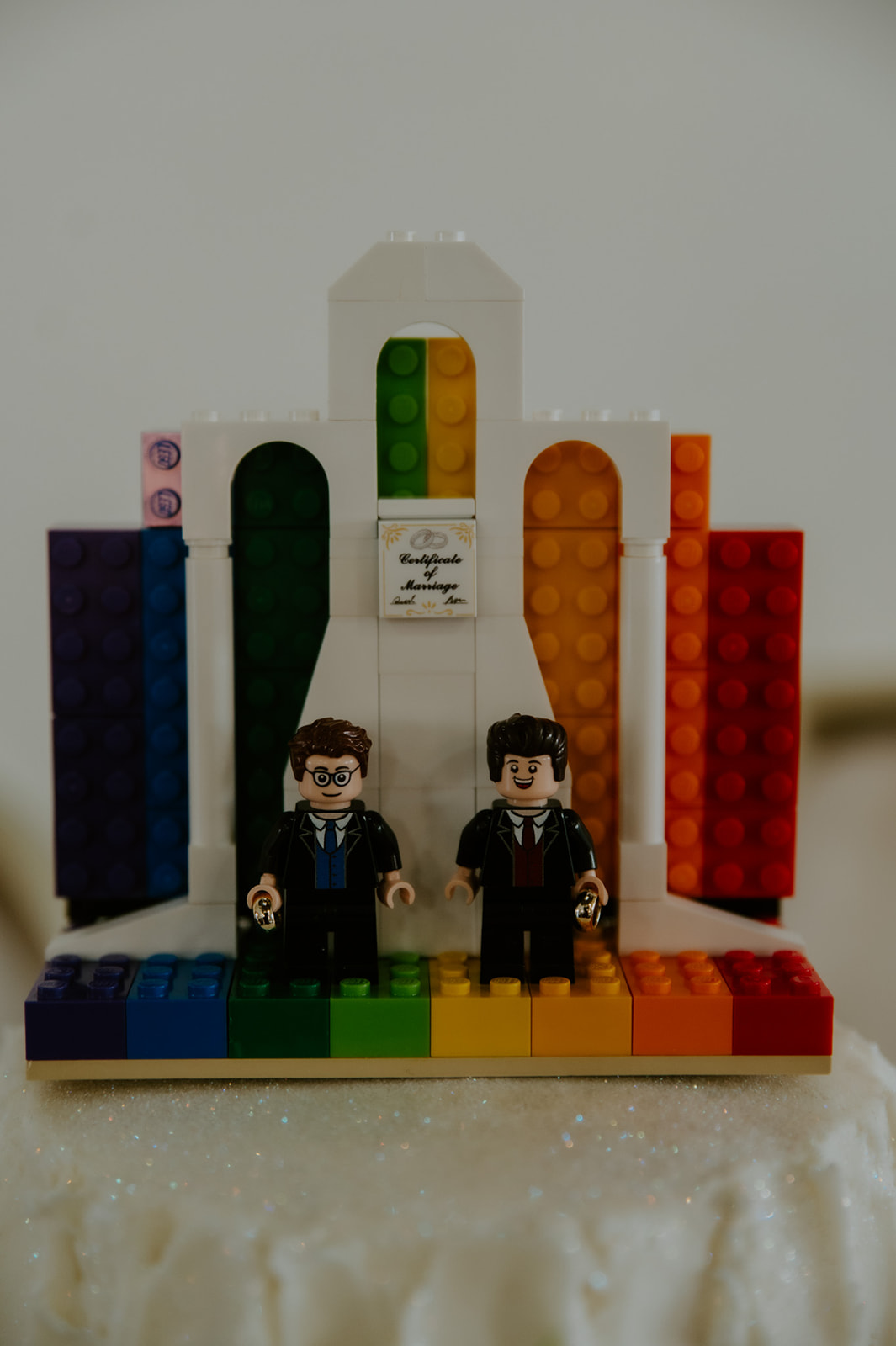 LEGO wedding cake topper with rainbow details from a playful and personal LGBTQ wedding celebration