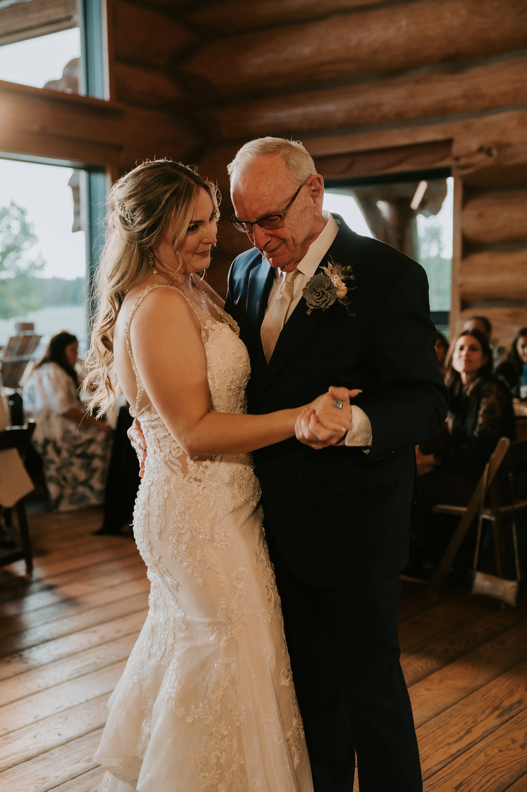 Bride dances with an older family member during the reception, creating a heartfelt wedding memory surrounded by loved ones.
