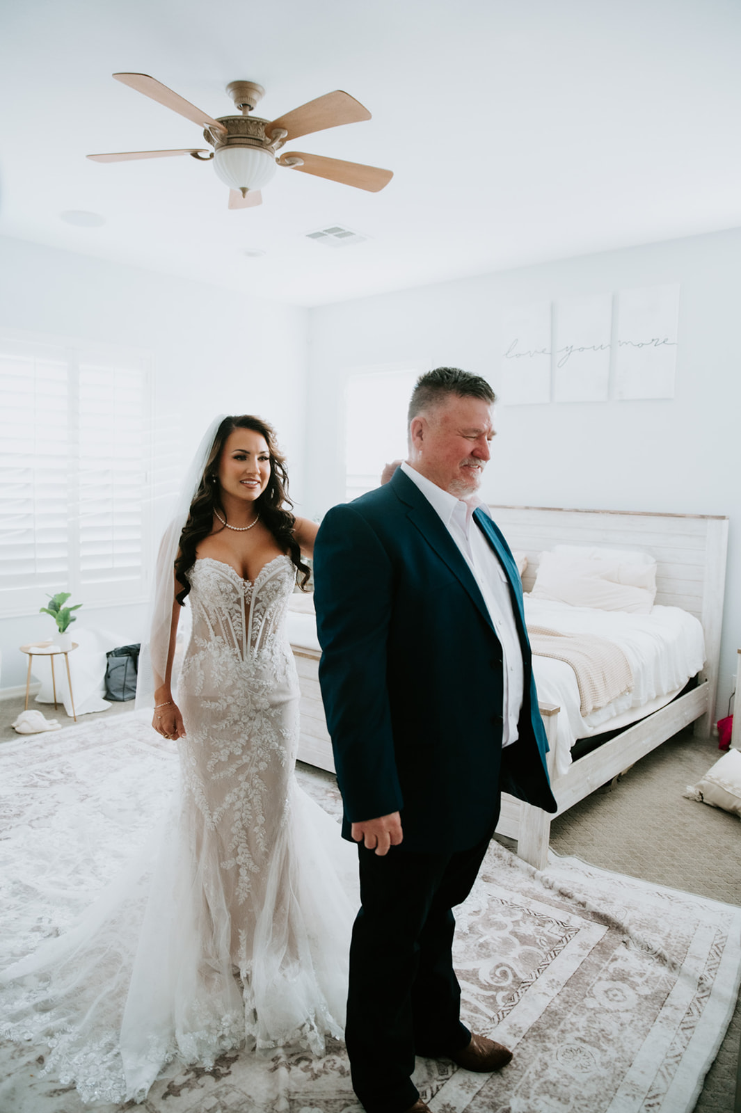 Bride surprises her father with a first look before the ceremony, a heartfelt moment among intimate backyard wedding ideas.
